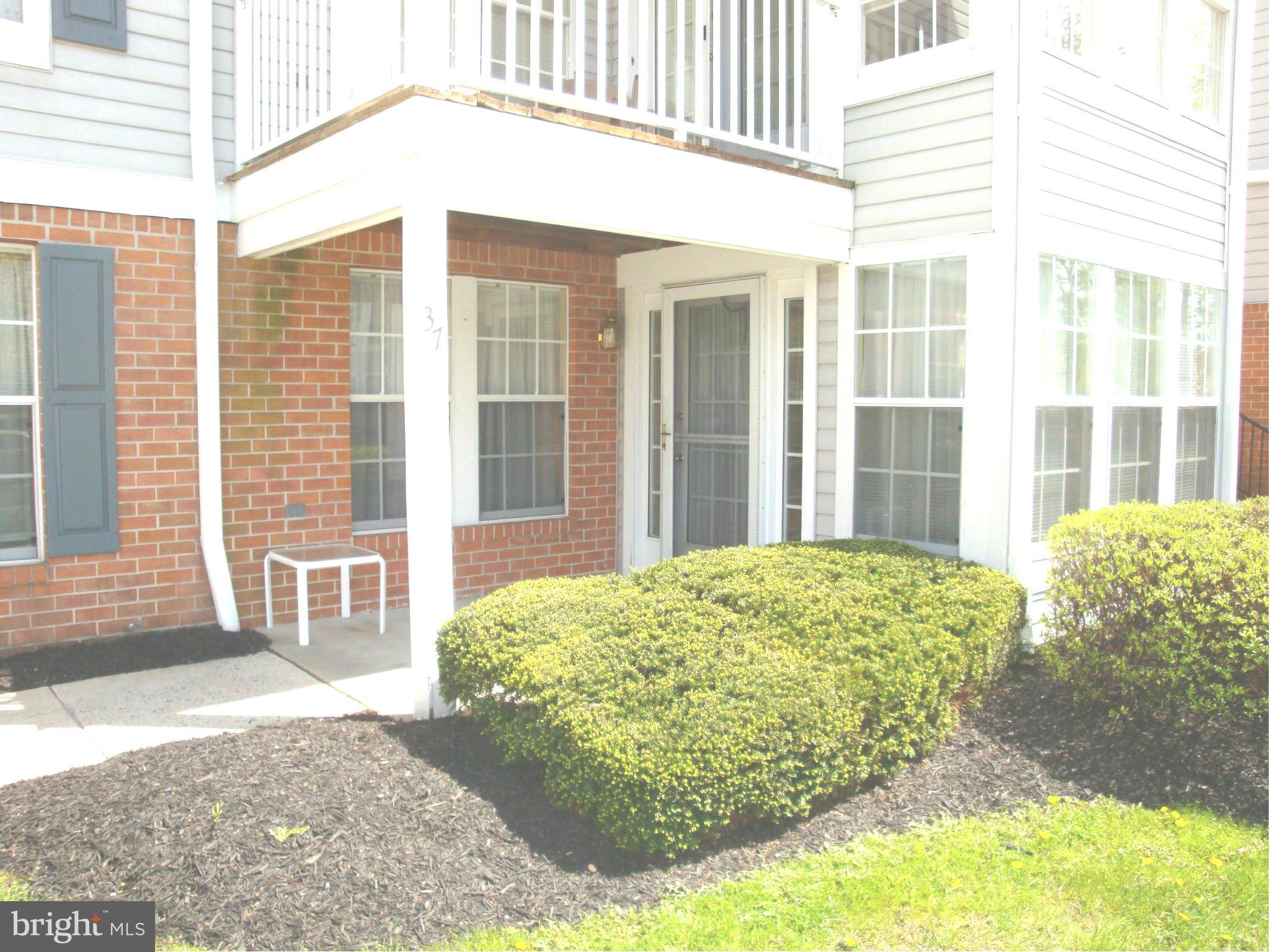 37 Laurel Path Court, Unit 37 Baltimore, MD 21236 - Photo 1 of 22 a view of a porch with a bench