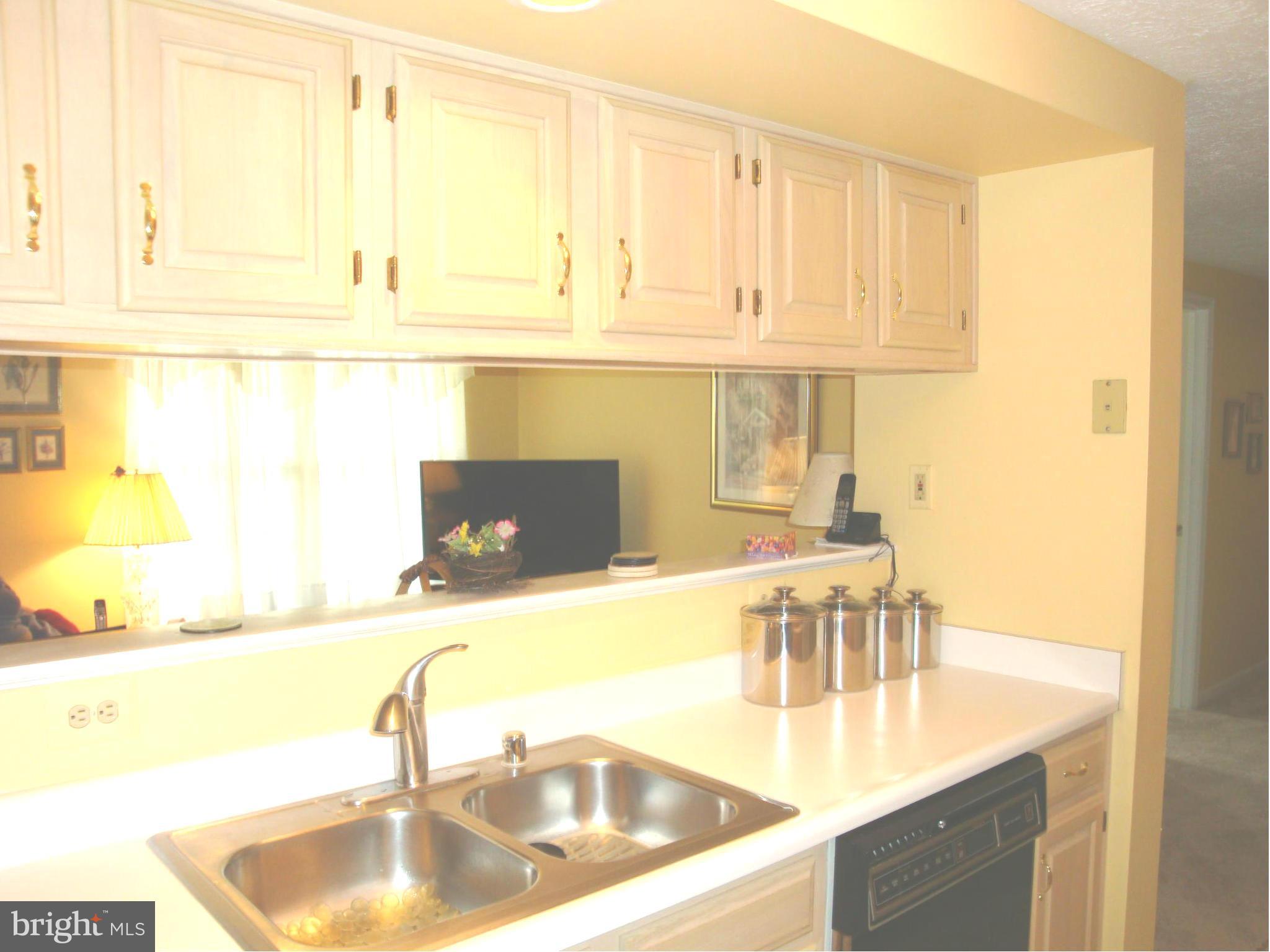 37 Laurel Path Court, Unit 37 Baltimore, MD 21236 - Photo 12 of 22 a kitchen with a sink and a wooden floor