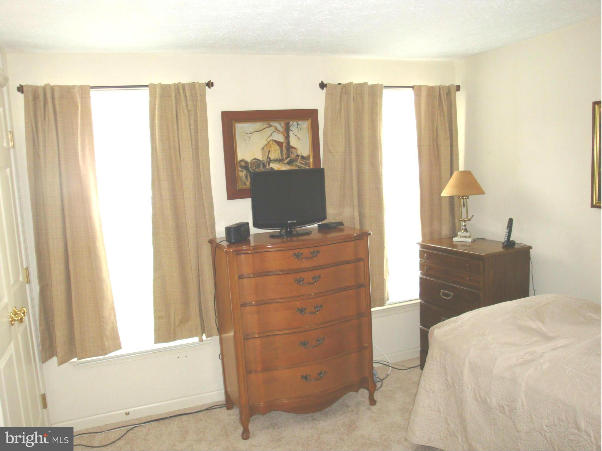 37 Laurel Path Court, Unit 37 Baltimore, MD 21236 - Photo 14 of 22 a bedroom with a bed and a dresser