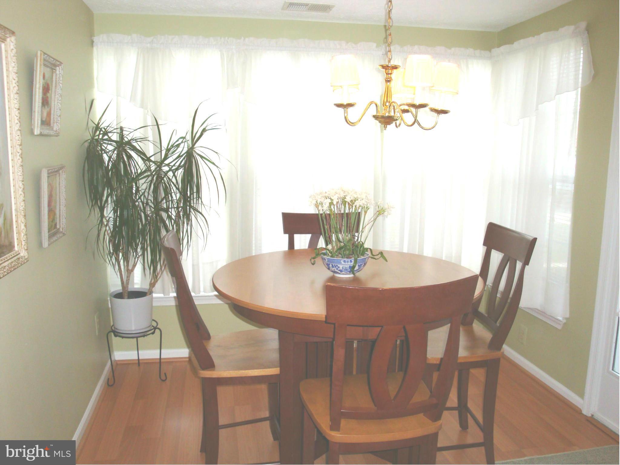 37 Laurel Path Court, Unit 37 Baltimore, MD 21236 - Photo 16 of 22 a view of a dining room with furniture and wooden floor
