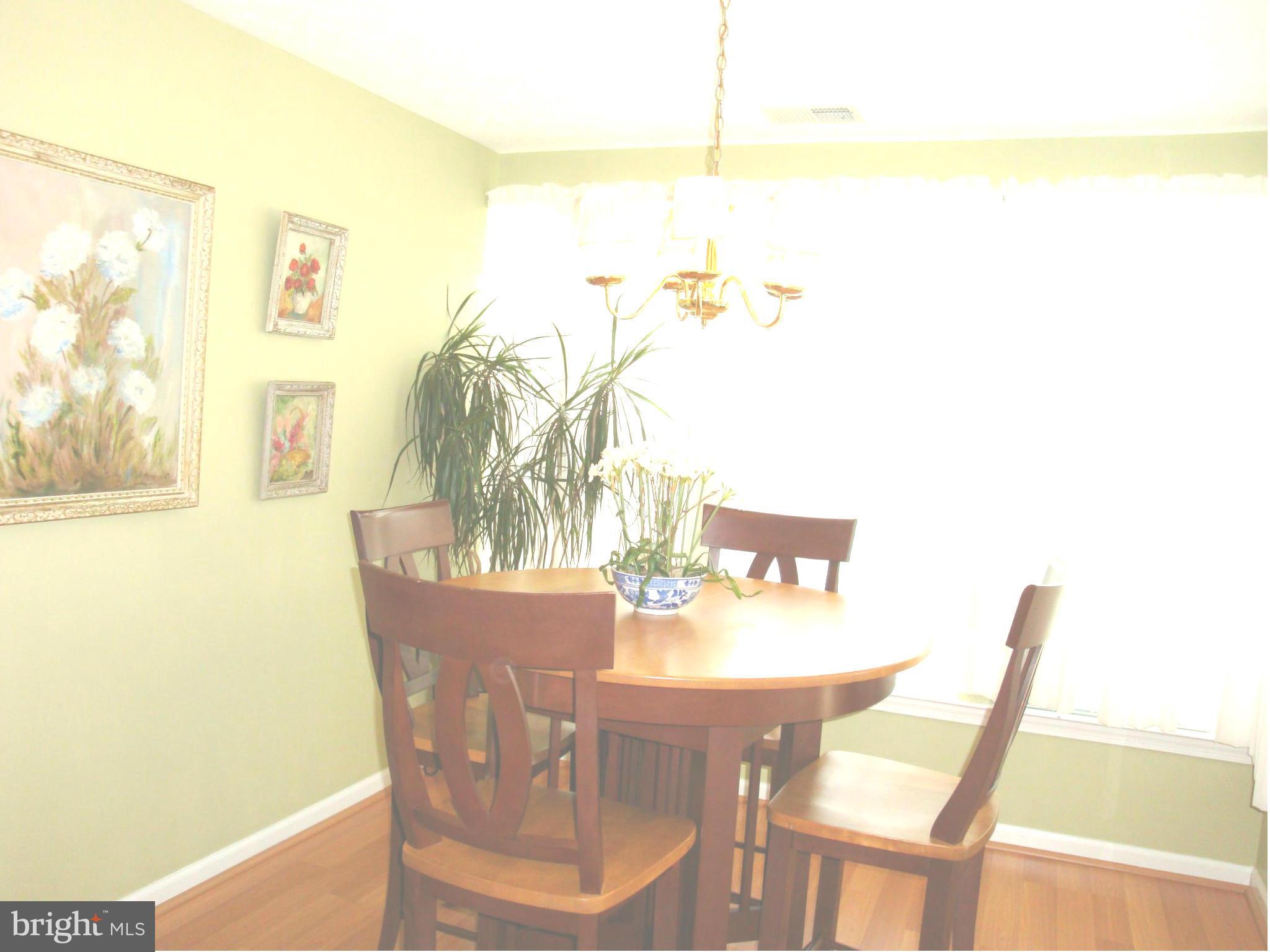 37 Laurel Path Court, Unit 37 Baltimore, MD 21236 - Photo 18 of 22 a view of a dining room with furniture and wooden floor