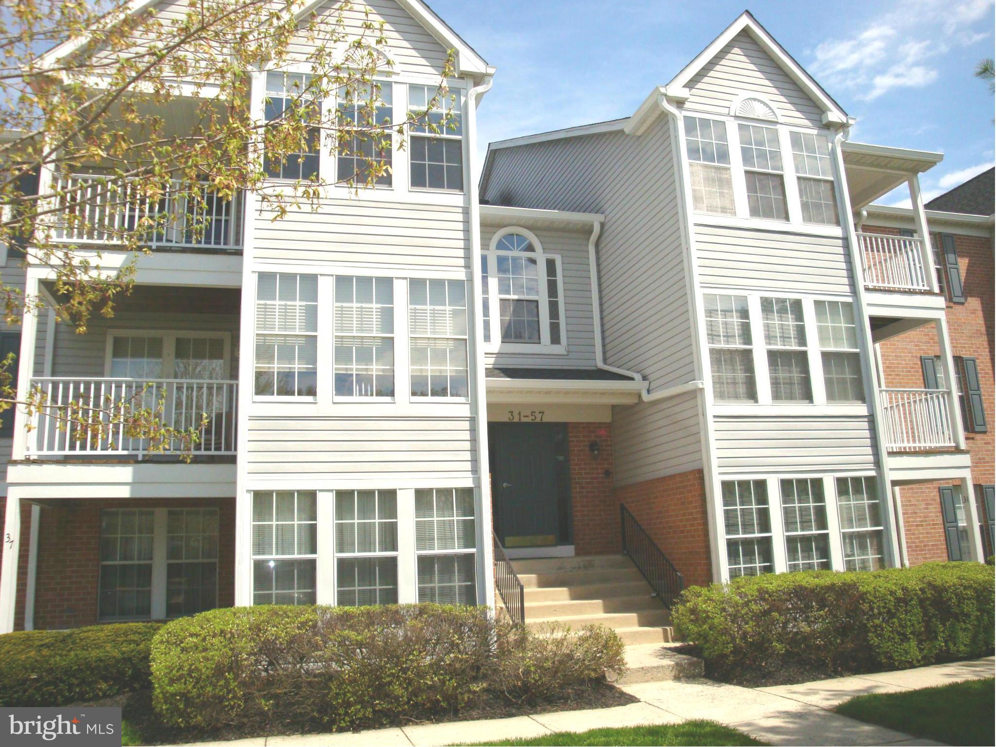 37 Laurel Path Court, Unit 37 Baltimore, MD 21236 - Photo 22 of 22 a front view of a house with a yard