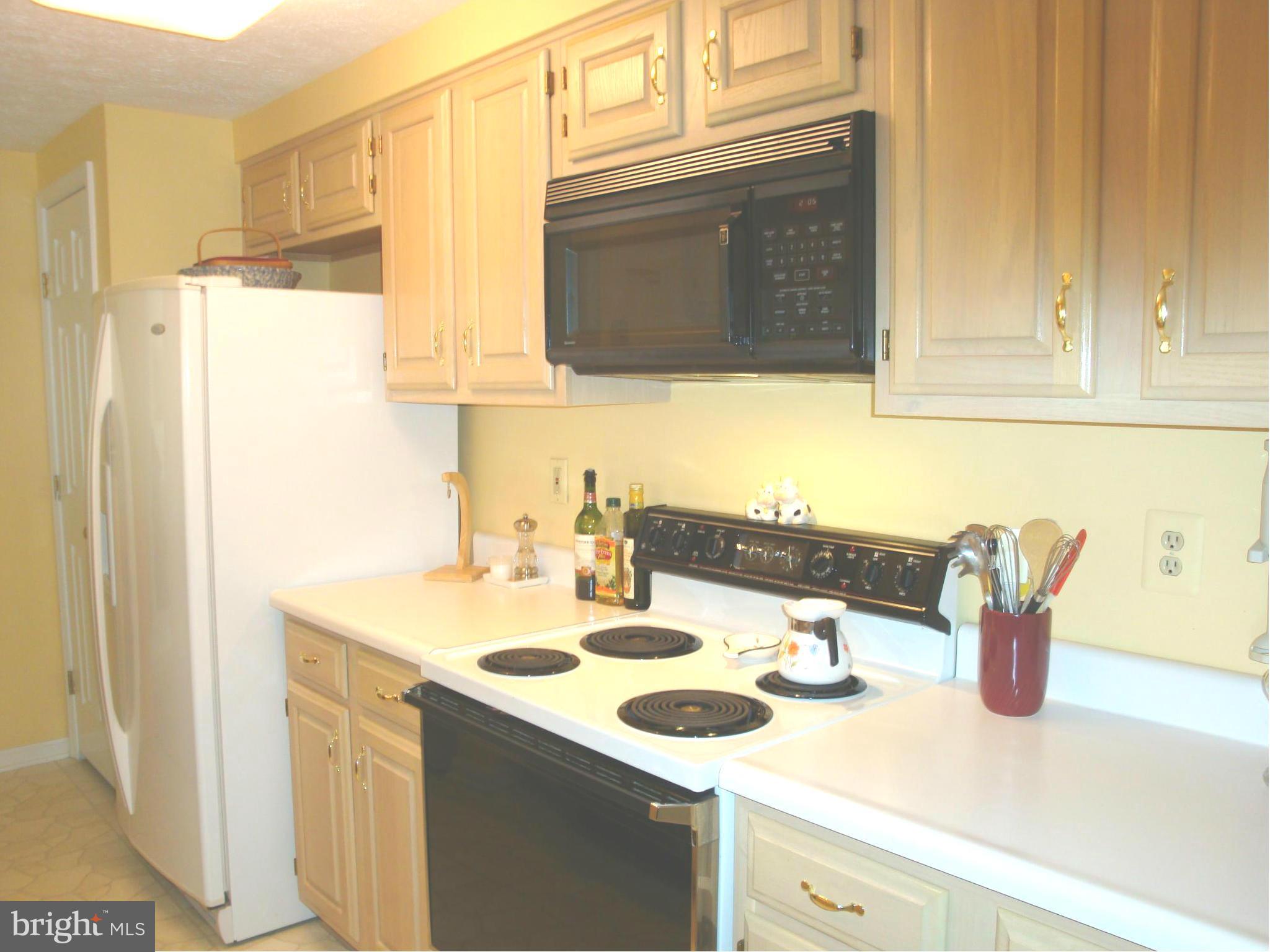 37 Laurel Path Court, Unit 37 Baltimore, MD 21236 - Photo 10 of 22 a kitchen with a sink and a stove top oven