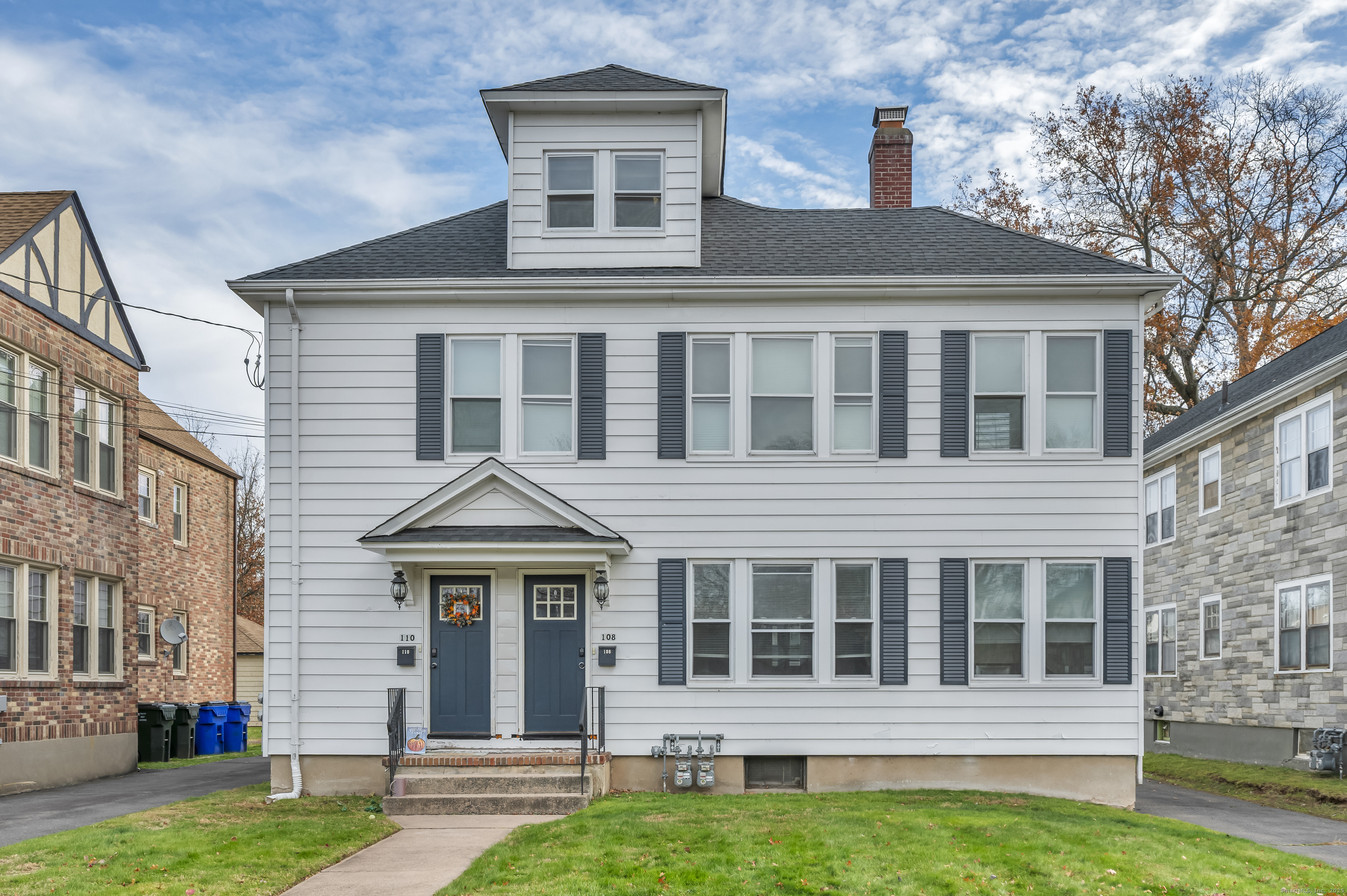 a front view of a house with a yard
