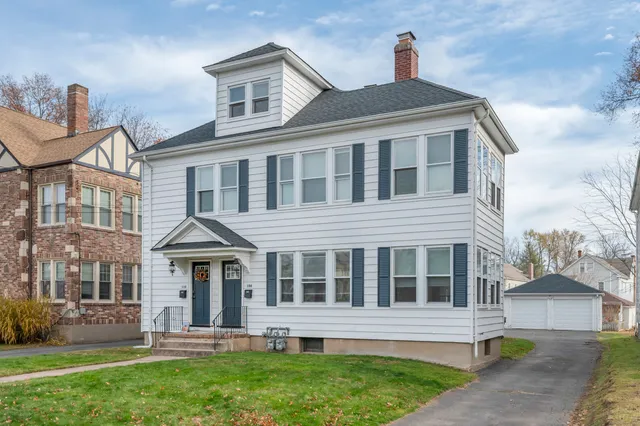 a front view of a house with a yard