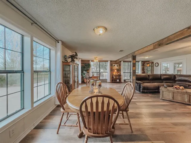 a view of a dining room with furniture window and outside view