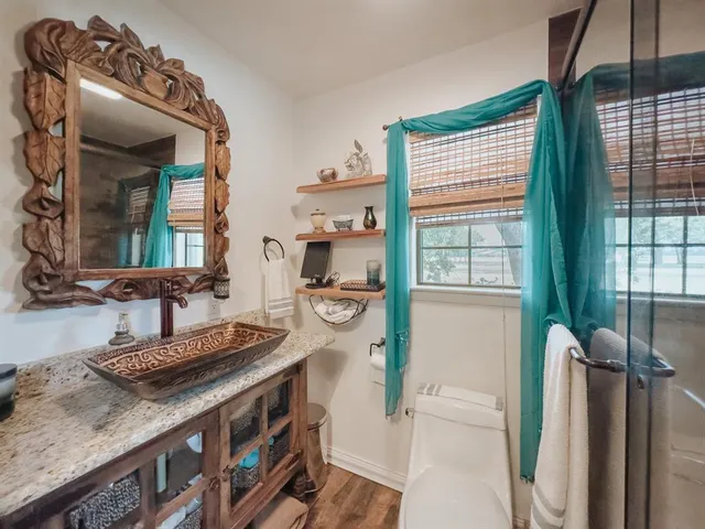 a kitchen with a stove a sink and a refrigerator