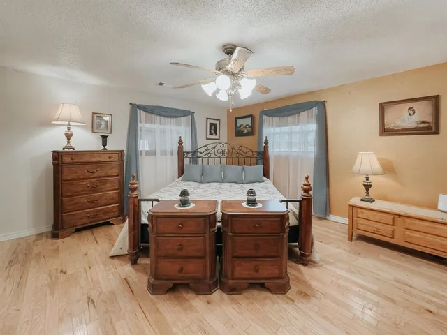 a room with a dresser and a wooden floor
