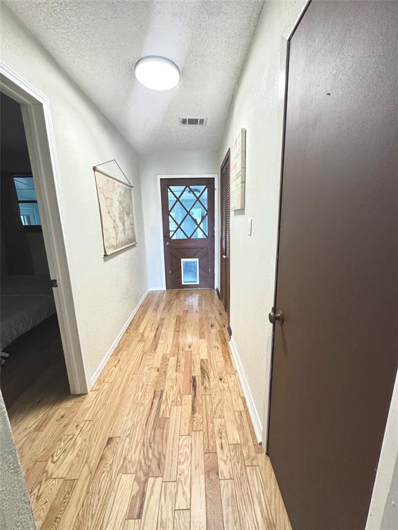 205 Peach Tree Road Mabank, TX 75156 - Photo 25 of 40 a view of empty room with wooden floor