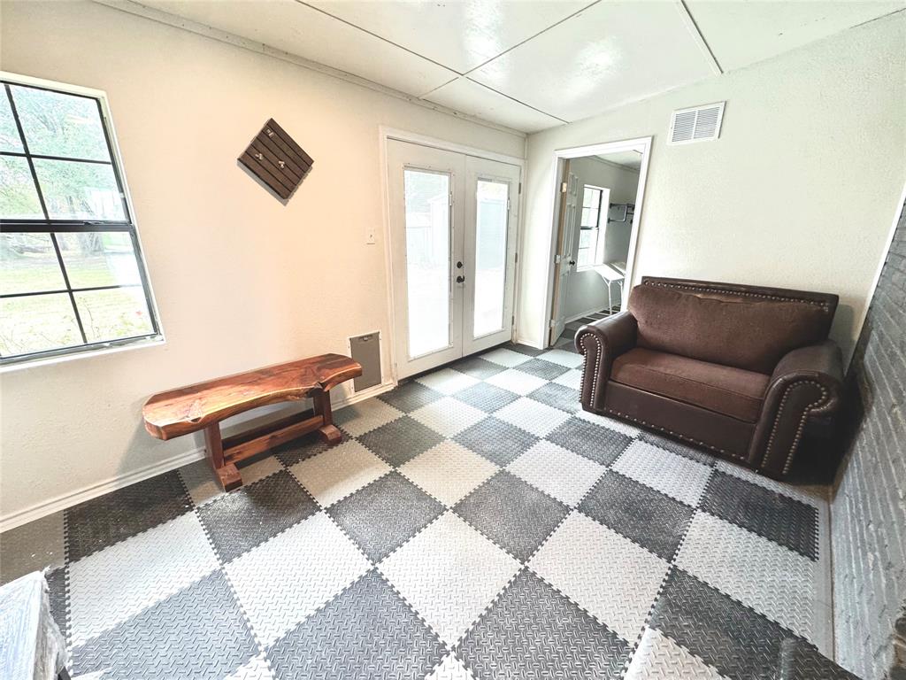 205 Peach Tree Road Mabank, TX 75156 - Photo 26 of 40 a living room with a couch and a coffee table