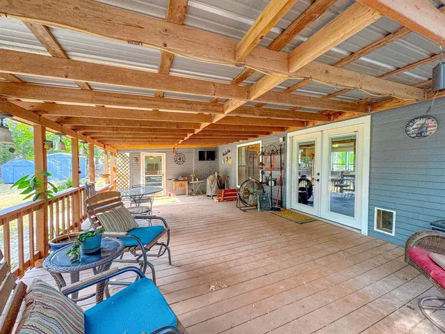 a view of a chairs in wooden deck