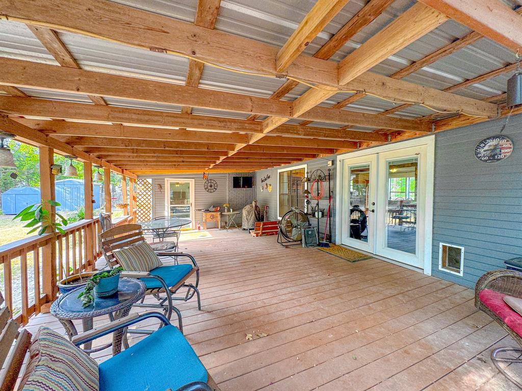 205 Peach Tree Road Mabank, TX 75156 - Photo 29 of 40 a view of a chairs in wooden deck