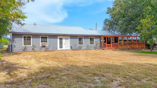 front view of a house with a yard