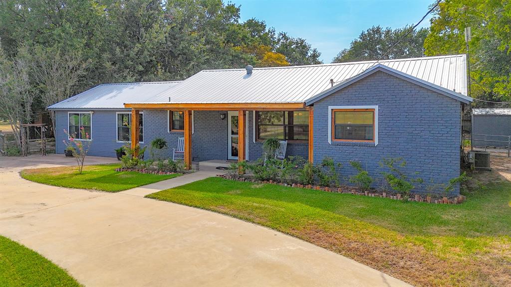 205 Peach Tree Road Mabank, TX 75156 - Photo 38 of 40 a view of a house with garden and yard