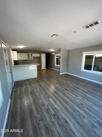 a kitchen with sink refrigerator and window
