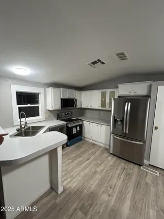 a view of a livingroom with wooden floor