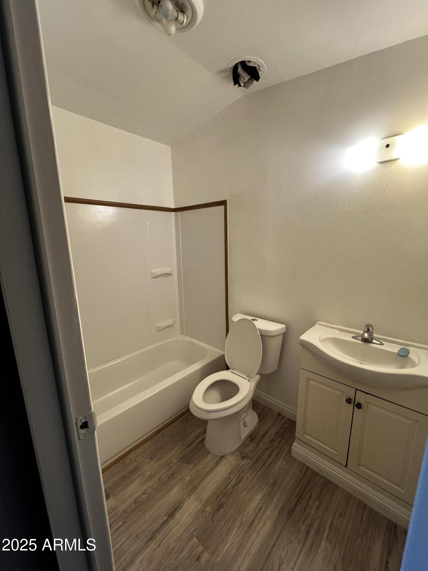 11201 East Jupiter Drive Apache Junction, AZ 85120 - Photo 34 of 35 a bathroom with a sink a toilet a mirror and shower