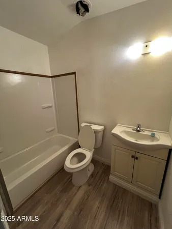 a kitchen with a sink and a refrigerator