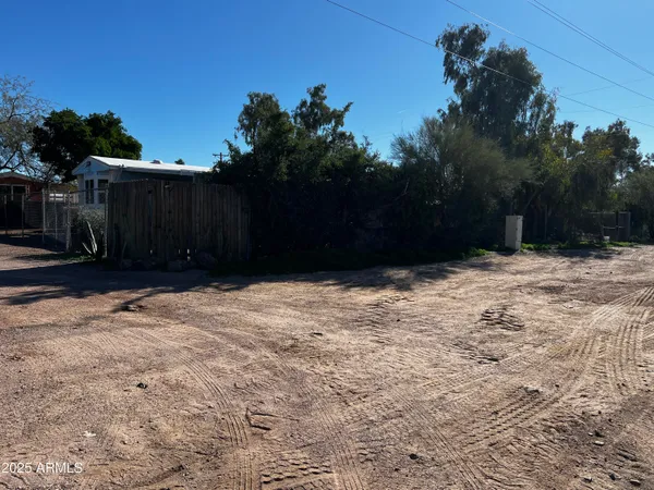 a view of a backyard of the house
