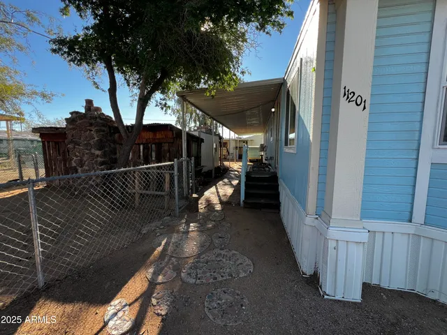 a kitchen with a sink a stove and a wooden cabinets