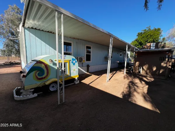 a view of a wooden door and a wooden fence