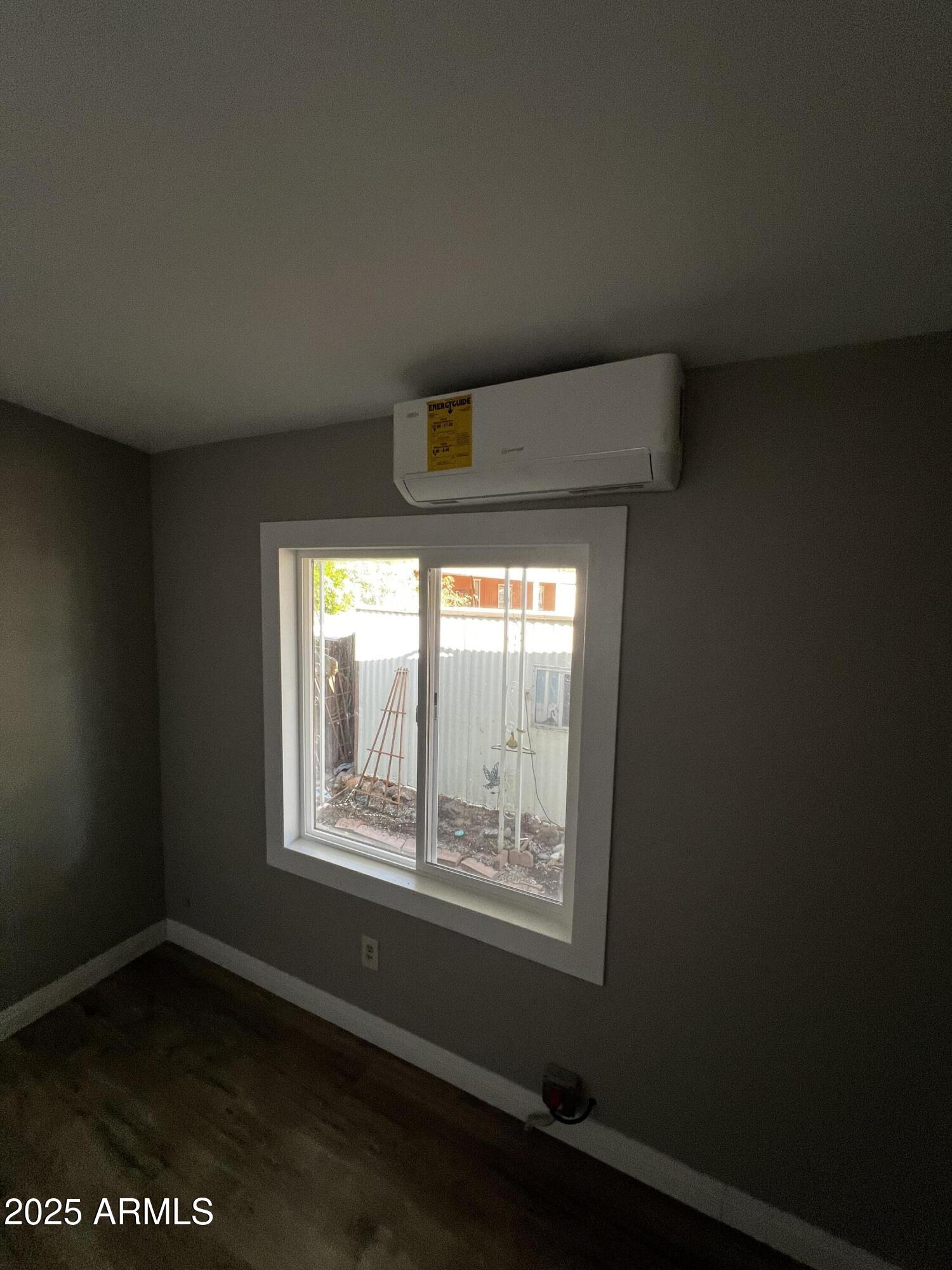 11201 East Jupiter Drive Apache Junction, AZ 85120 - Photo 8 of 35 a view of an empty room with a window