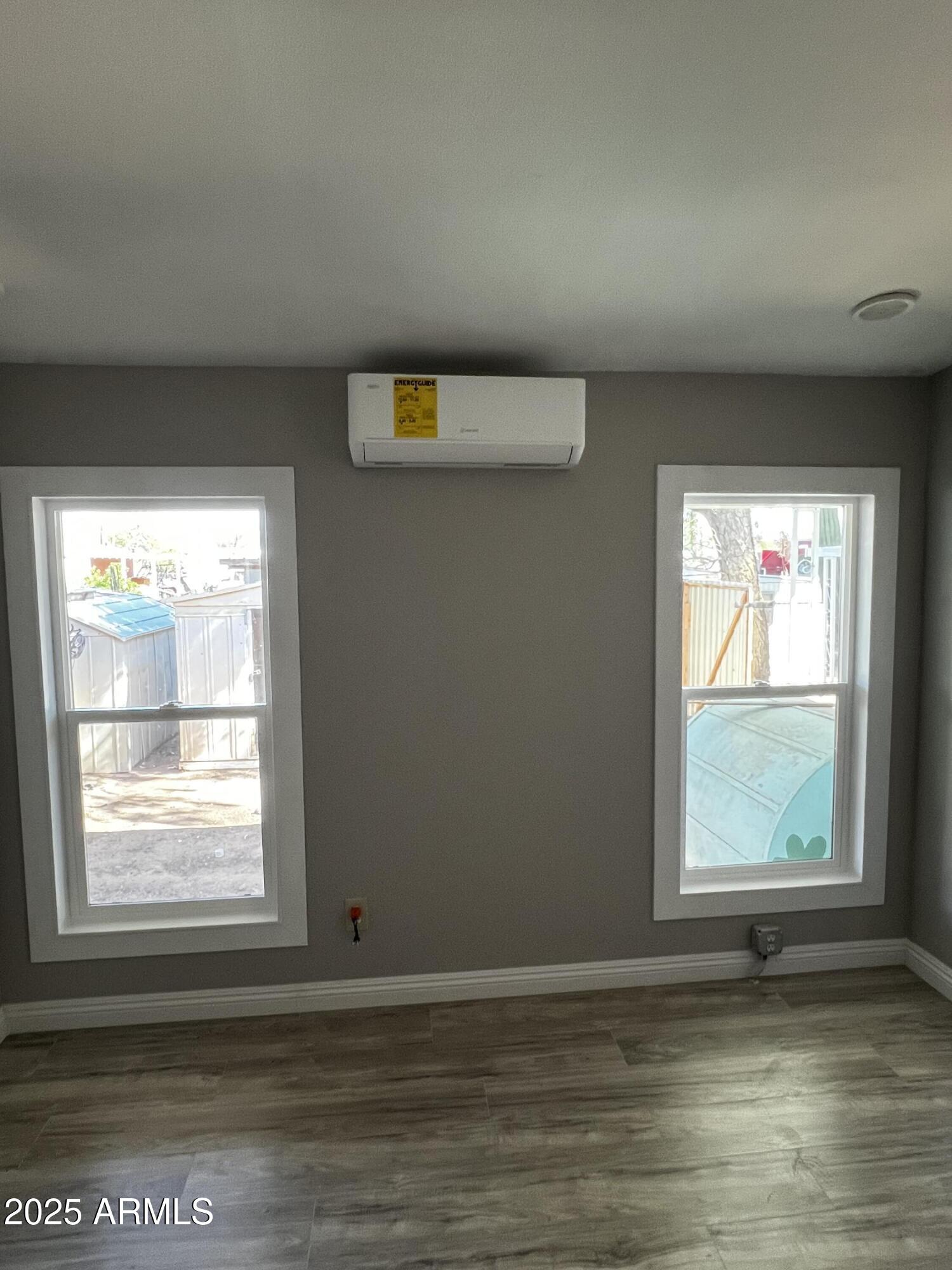 11201 East Jupiter Drive Apache Junction, AZ 85120 - Photo 9 of 35 a view of an empty room with a window