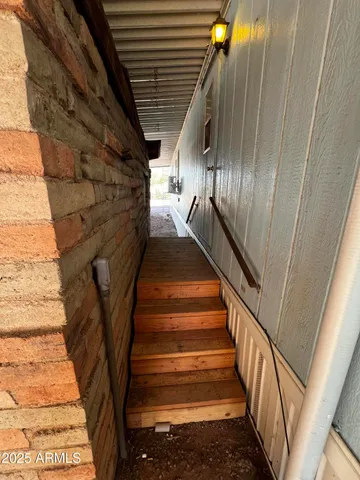 a bathroom with a granite countertop sink toilet and mirror