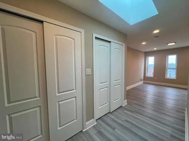 a view of gallery with wooden floor