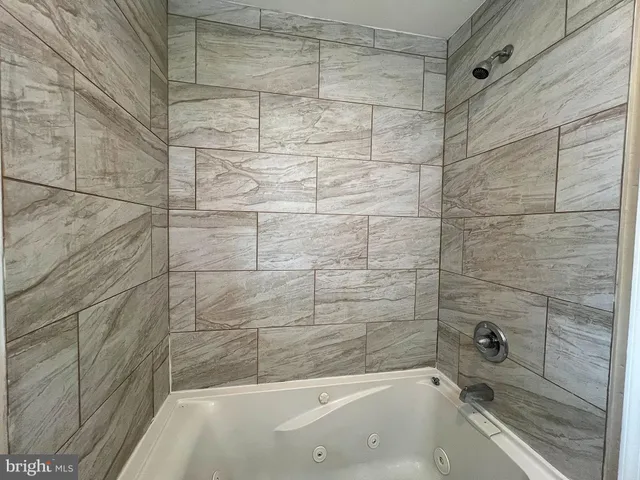 a bathroom with a bathtub