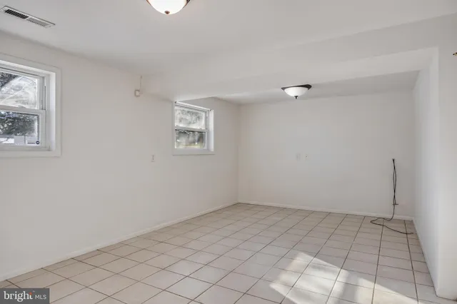 a view of a room with window and wooden floor