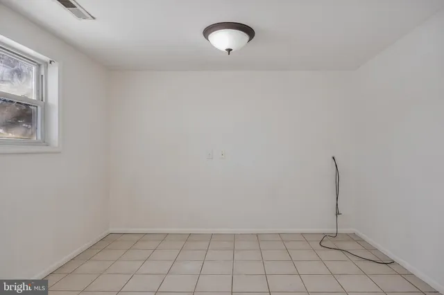 a view of a room with white walls