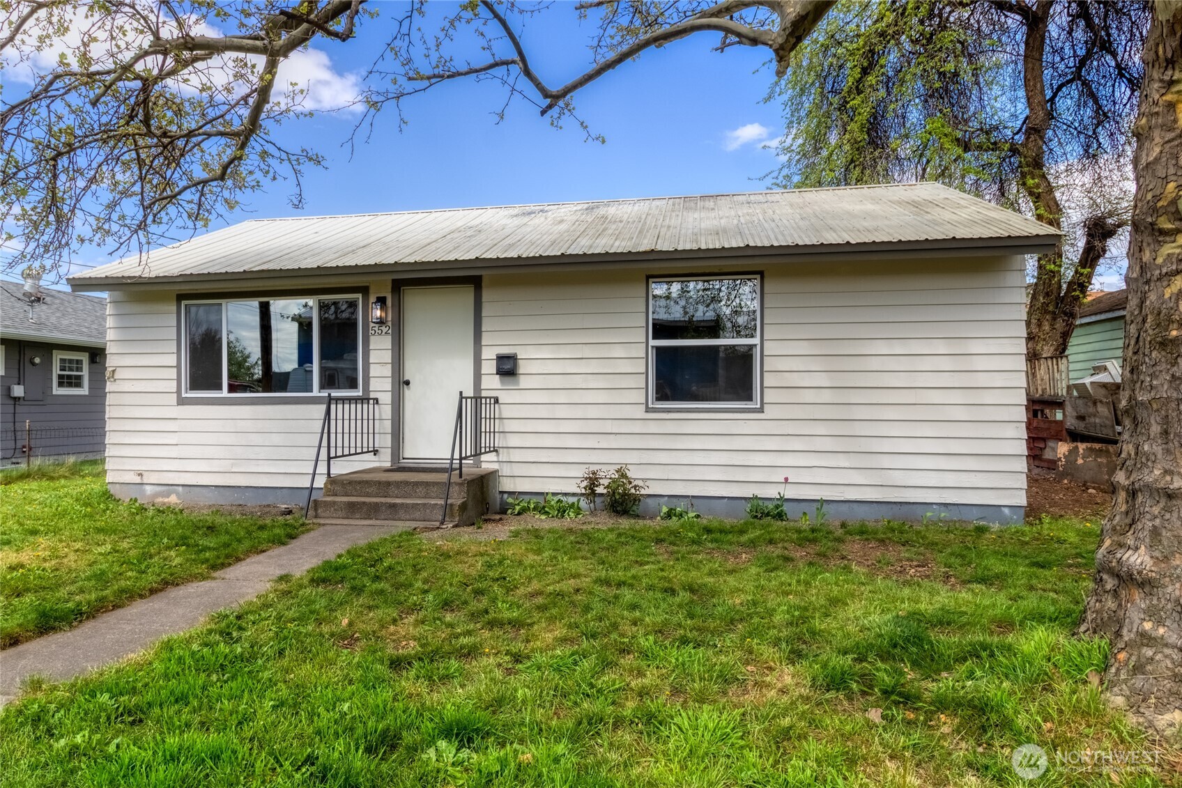 a front view of a house with garage