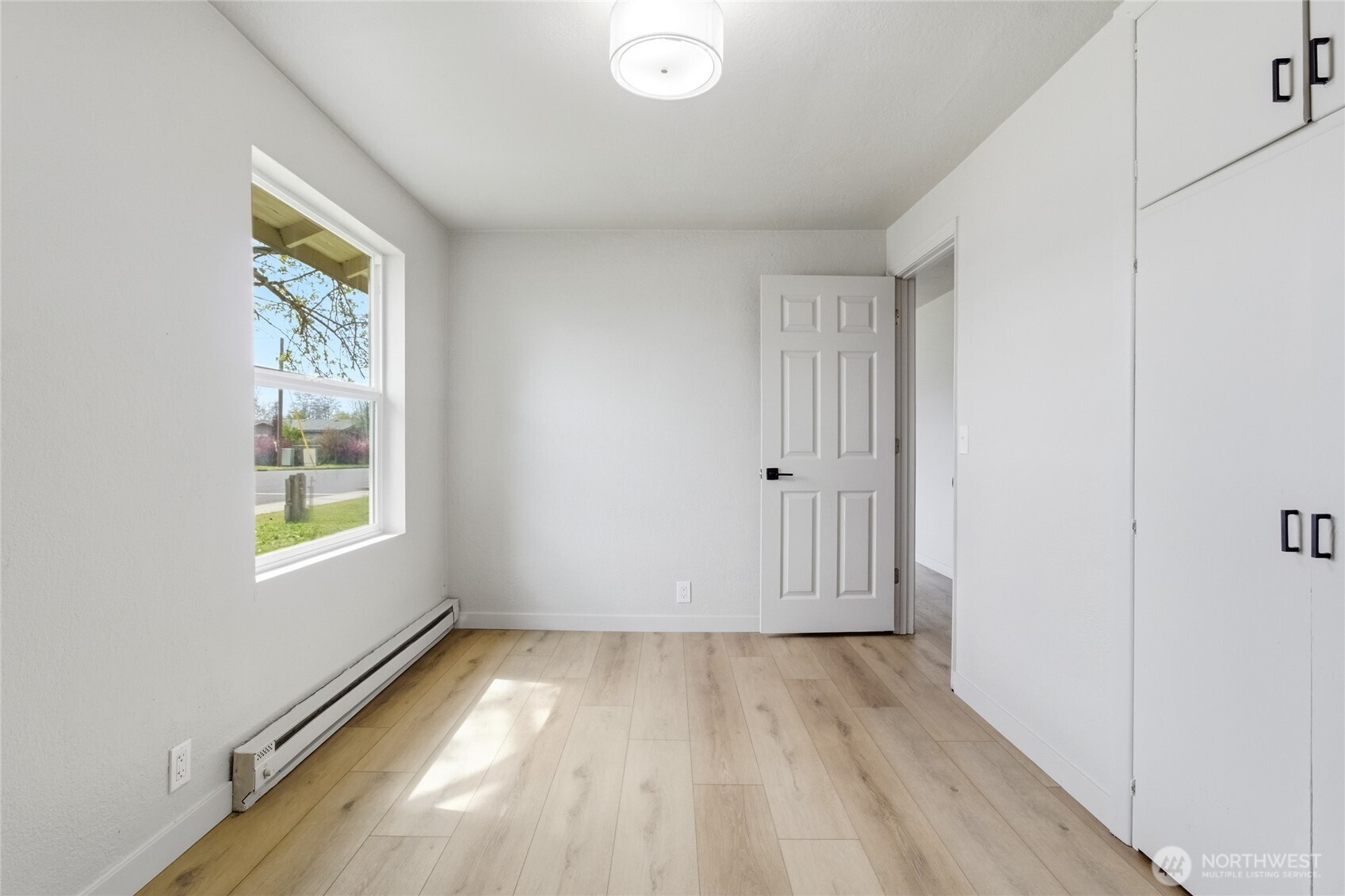552 Edith Avenue Walla Walla, WA 99362 - Photo 13 of 19 a view of room with window and hardwood floor