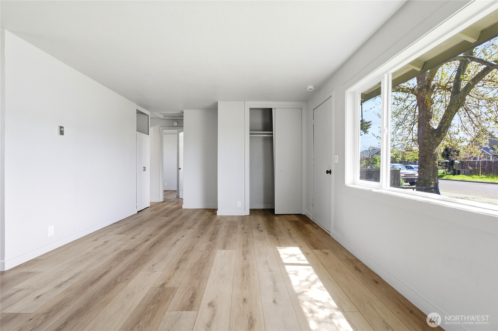 552 Edith Avenue Walla Walla, WA 99362 - Photo 3 of 19 a view of an empty room with wooden floor and a window