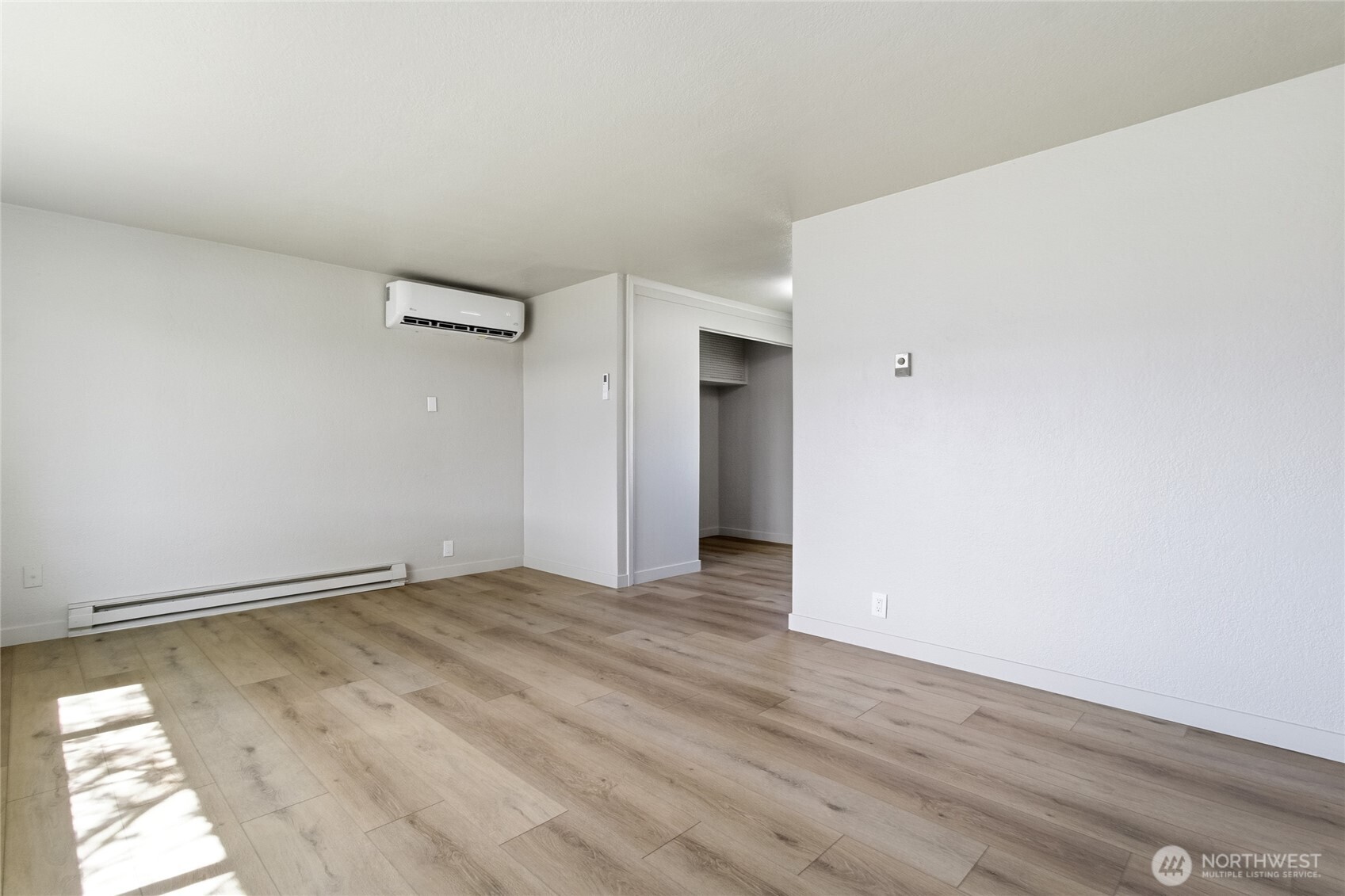 552 Edith Avenue Walla Walla, WA 99362 - Photo 5 of 19 a view of an empty room with wooden floor