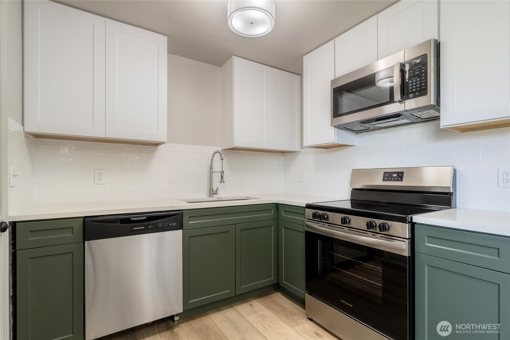 552 Edith Avenue Walla Walla, WA 99362 - Photo 7 of 19 a kitchen with cabinets stainless steel appliances and wooden cabinets
