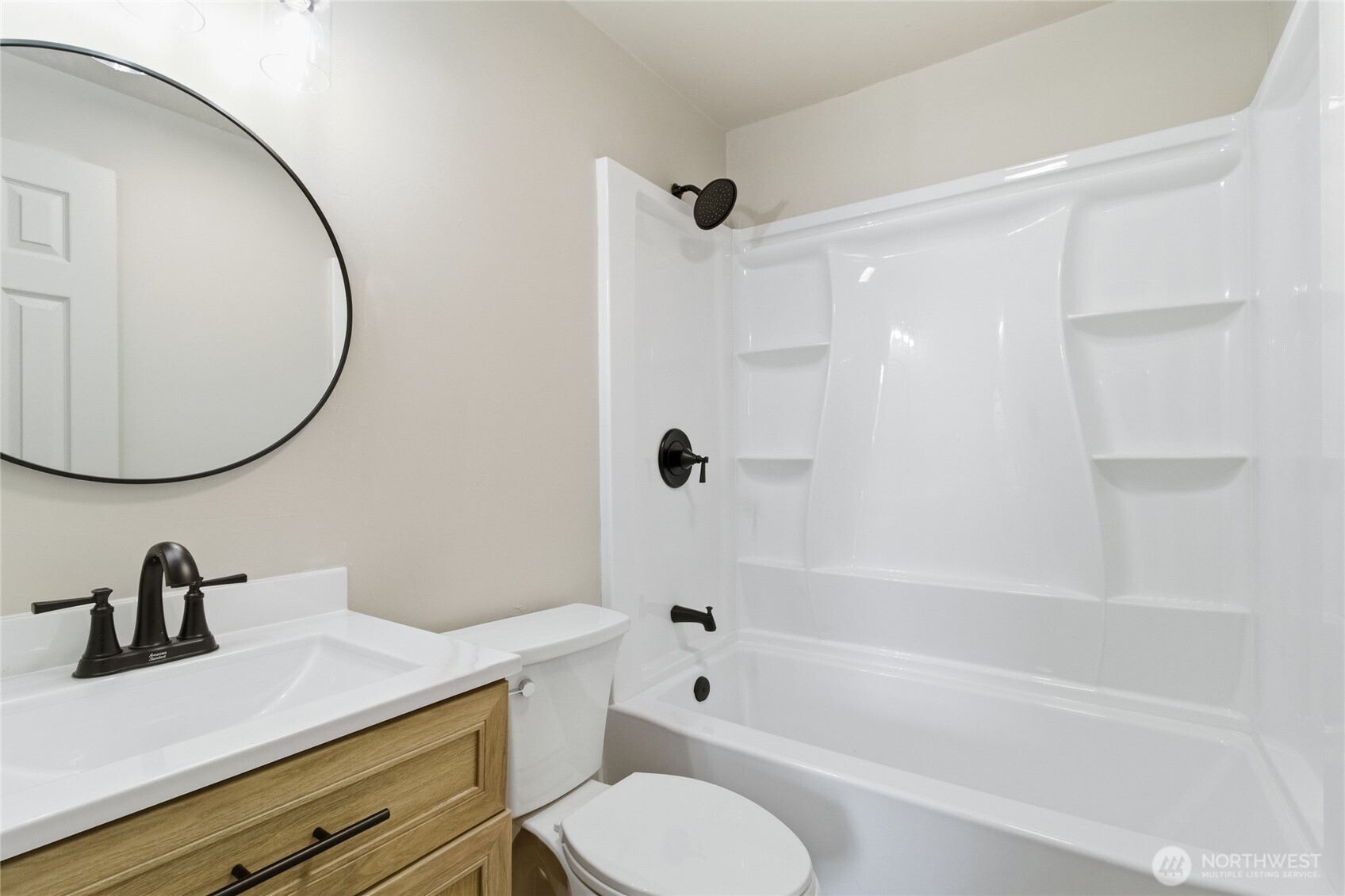 552 Edith Avenue Walla Walla, WA 99362 - Photo 10 of 19 a bathroom with a sink a toilet and a mirror