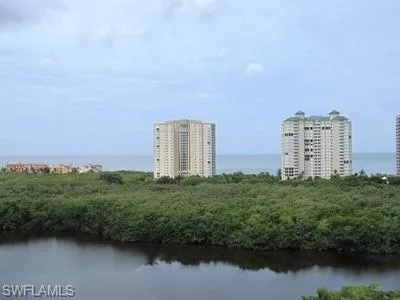 a view of a city with tall buildings and a lake view