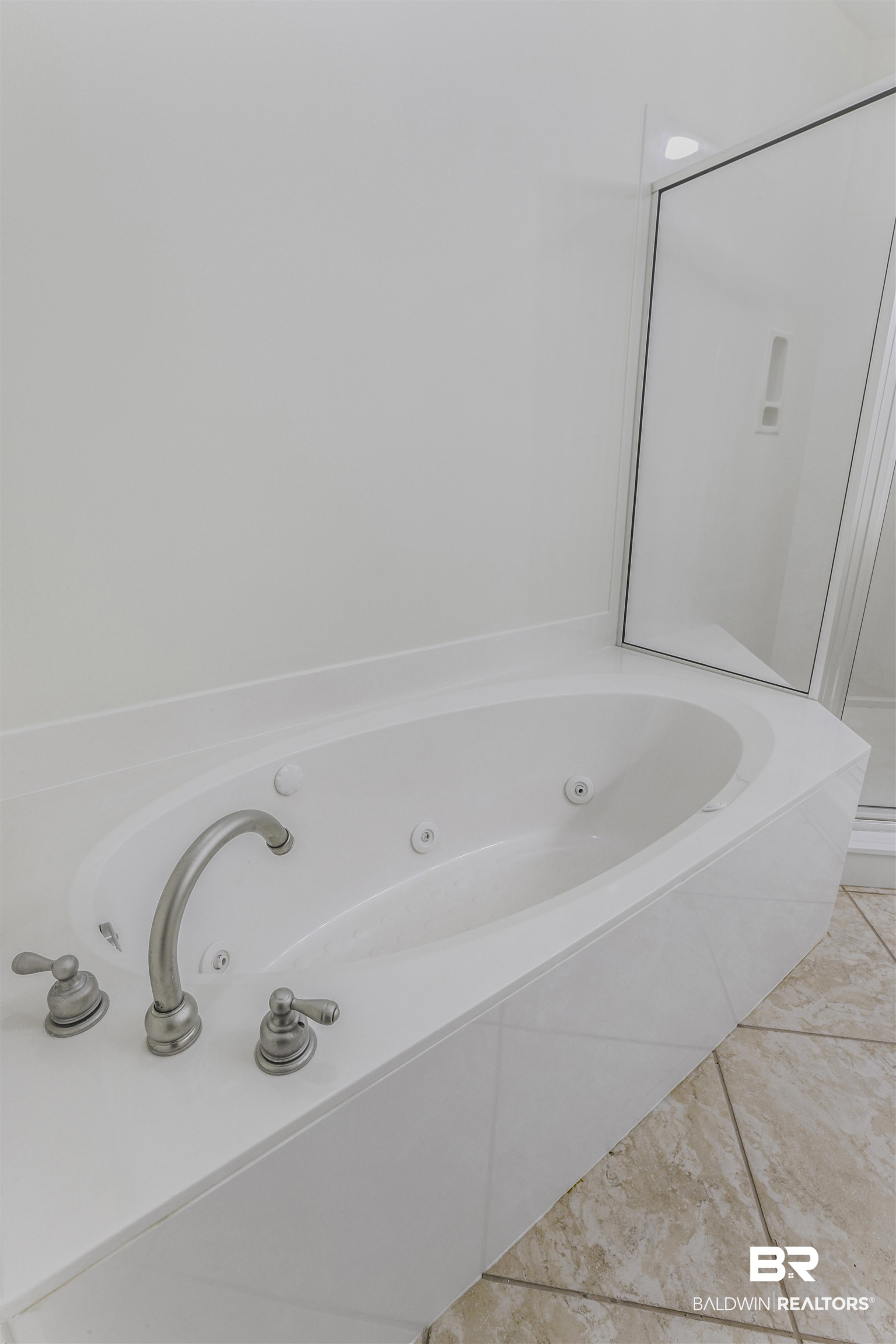 28250 Canal Road, Unit 106 Orange Beach, AL 36561 - Photo 21 of 50 Bathroom with a whirlpool tub, a stall shower, and light tile patterned floors