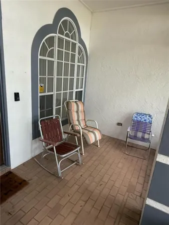 a living room with furniture and windows