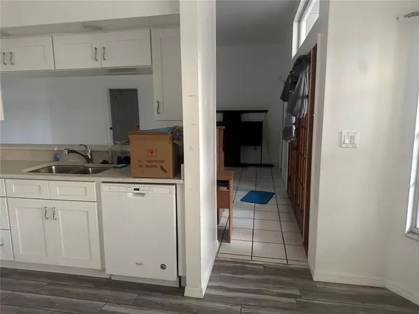 a view of a kitchen from the hallway