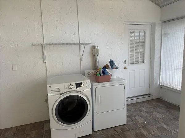 a utility room with dryer and washer