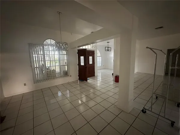 a bathroom with a black and white checkered floor