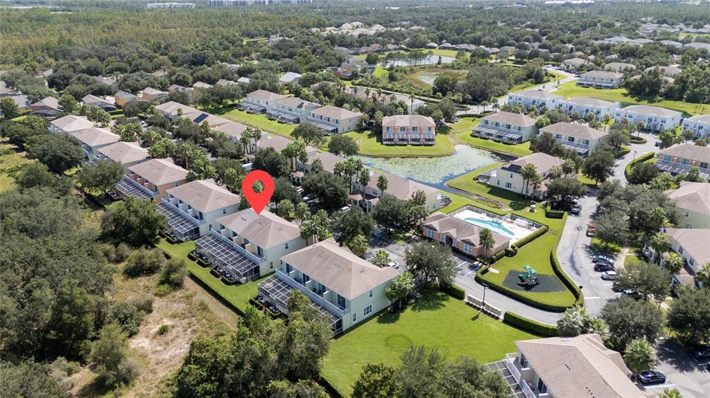 17417 Placidity Avenue Clermont, FL 34714 - Photo 13 of 25 an aerial view of residential houses with outdoor space and parking