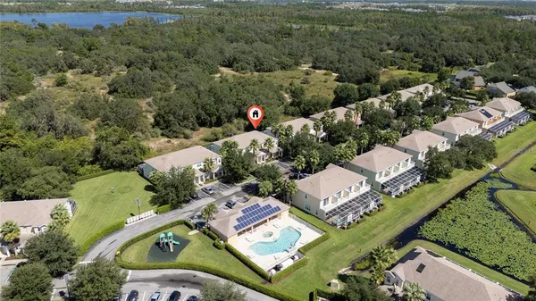an aerial view of a house with a garden