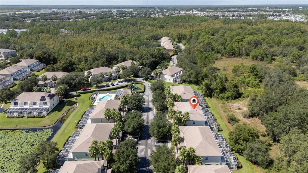 17417 Placidity Avenue Clermont, FL 34714 - Photo 15 of 25 an aerial view of a city with lots of residential buildings