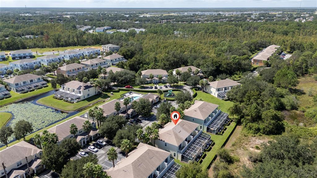 17417 Placidity Avenue Clermont, FL 34714 - Photo 19 of 25 an aerial view of a city with lots of residential buildings