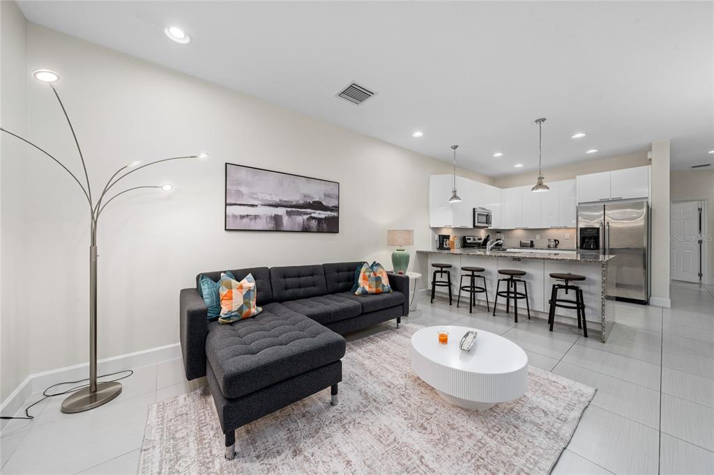 17417 Placidity Avenue Clermont, FL 34714 - Photo 25 of 25 a living room with furniture and a table