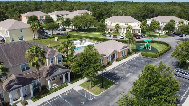 an aerial view of a house swimming pool patio and outdoor seating